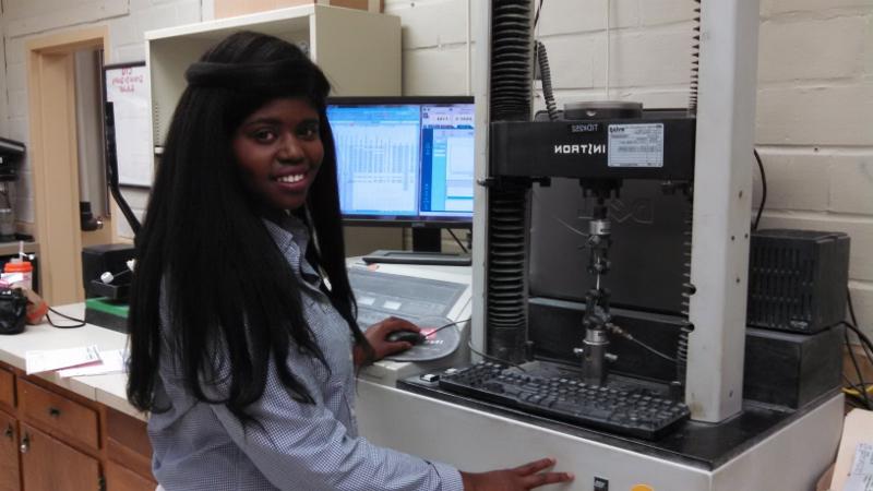 Landmark College student interning at a local science and research company.